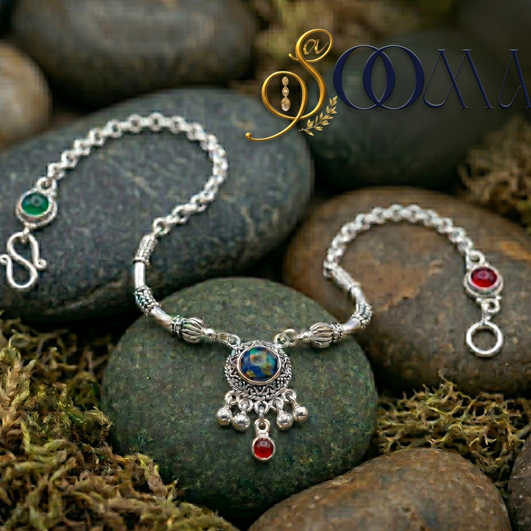Silver ankle bracelet with gemstones on stones and moss, featuring the brand 'Sooma'.