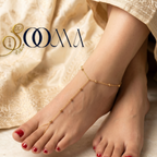 Gold-toned minimalist beaded toe ring anklet chain harness on foot