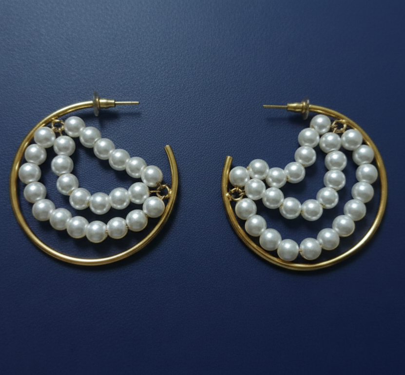 Golden beaded hoop earrings featuring elegant pearls