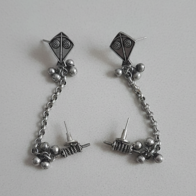 Kite Chain Earcuff - Close-up of kite detail and delicate chain.