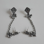 Kite Chain Earcuff - Close-up of kite detail and delicate chain.