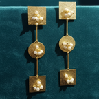 Elegant pearl gold drop earrings, perfect for office and everyday wear, on a teal background