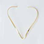 Elegant Modern Gold Hasli Necklace, minimalist design for versatile wear, against white background.