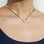 A model wearing Modern Gold Hasli Necklace, minimalist design for versatile wear.