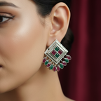 Close-up of a woman wearing a Multicolor Oxidized Silver Peacock Stud Earrings
