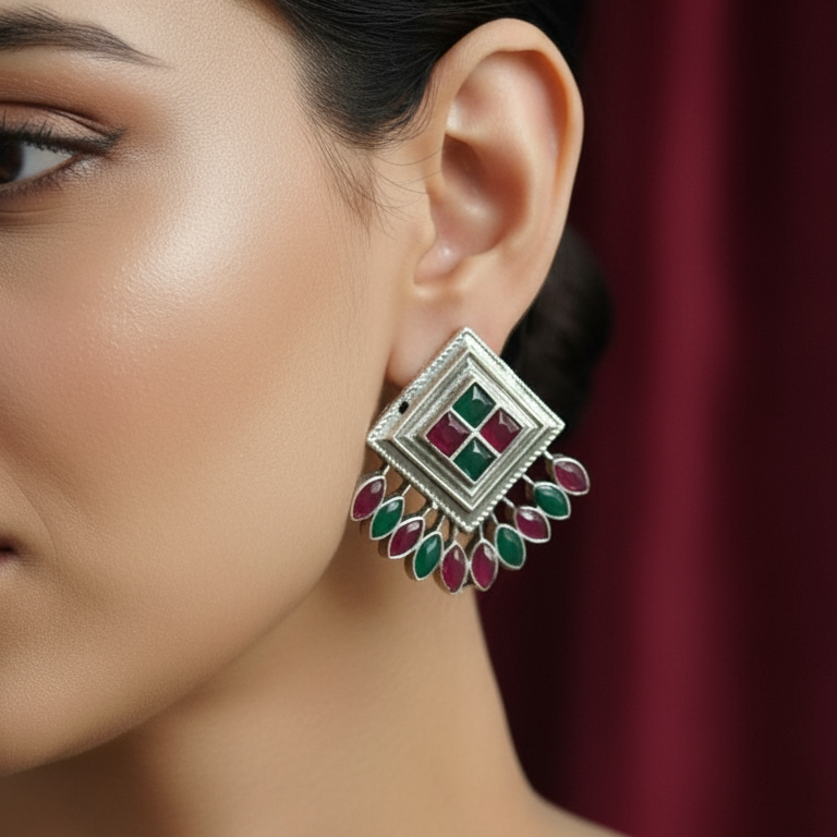 Close-up of a woman wearing a Multicolor Oxidized Silver Peacock Stud Earrings