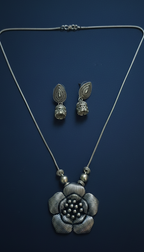 Oxidized Statement Pendant Set for Women on the blue background.