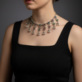 Woman wearing a Oxidized stone choker necklace with antique finish and subtle stone accent.