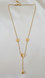 Gold necklace withbutterfly pendants on a white background