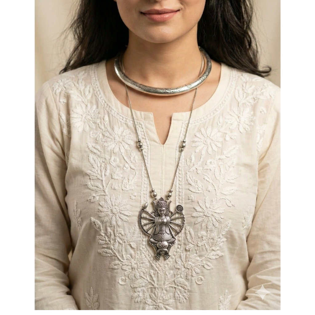 Woman wearing a elegant necklace stack complementing both ethnic and western wear.