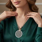 Woman wearing a green dress with a Boho silver neckpiece with intricate tribal design.