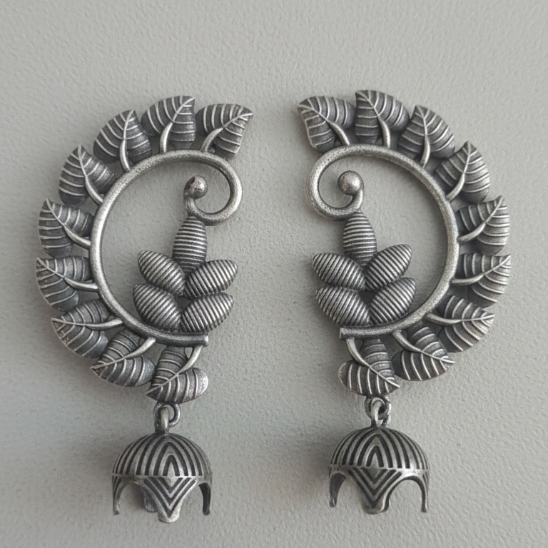 Pair of Oxidized jhumki earcuffs showcasing intricate tribal design.