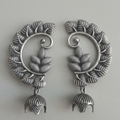Pair of Oxidized jhumki earcuffs showcasing intricate tribal design.