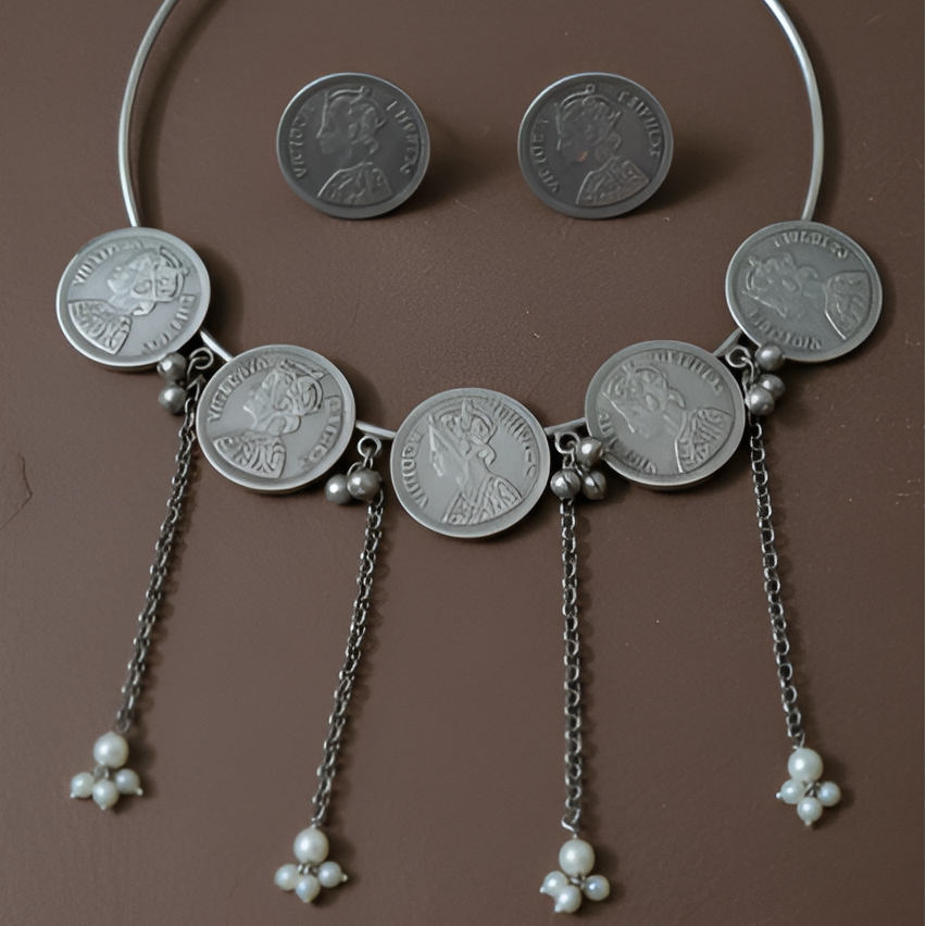  Handcrafted oxidised hasli coin necklace set for women,displayed against solid background.