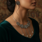 Silver hasli necklace with coin-like pendants and similar earrings