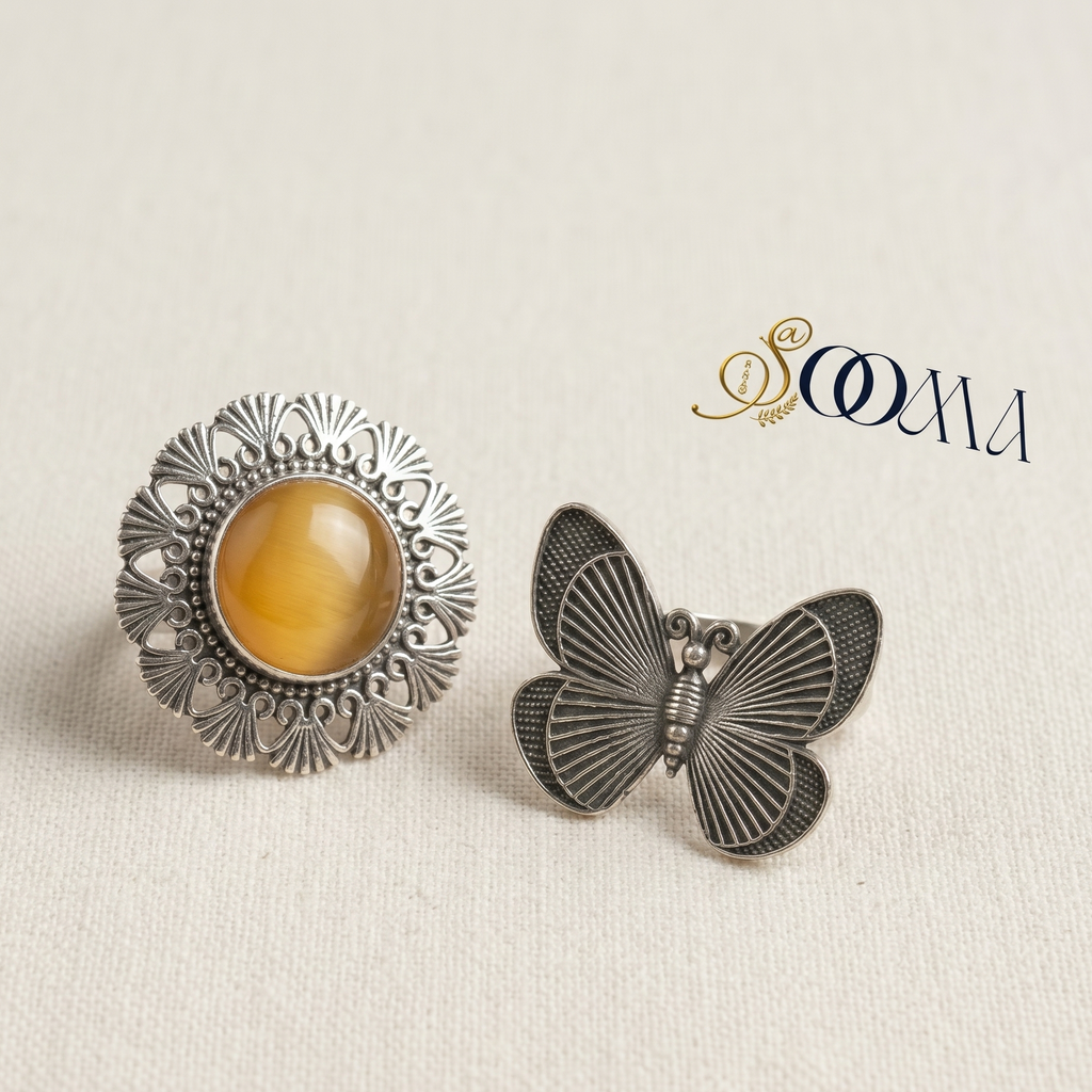 Two earrings, one round with amber stone and the other butterfly-shaped, on a beige background with 'Sooma' branding.