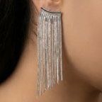 Close-up of an ear wearing Silver statement earrings with [briefly describe design, e.g., geometric pattern] 
