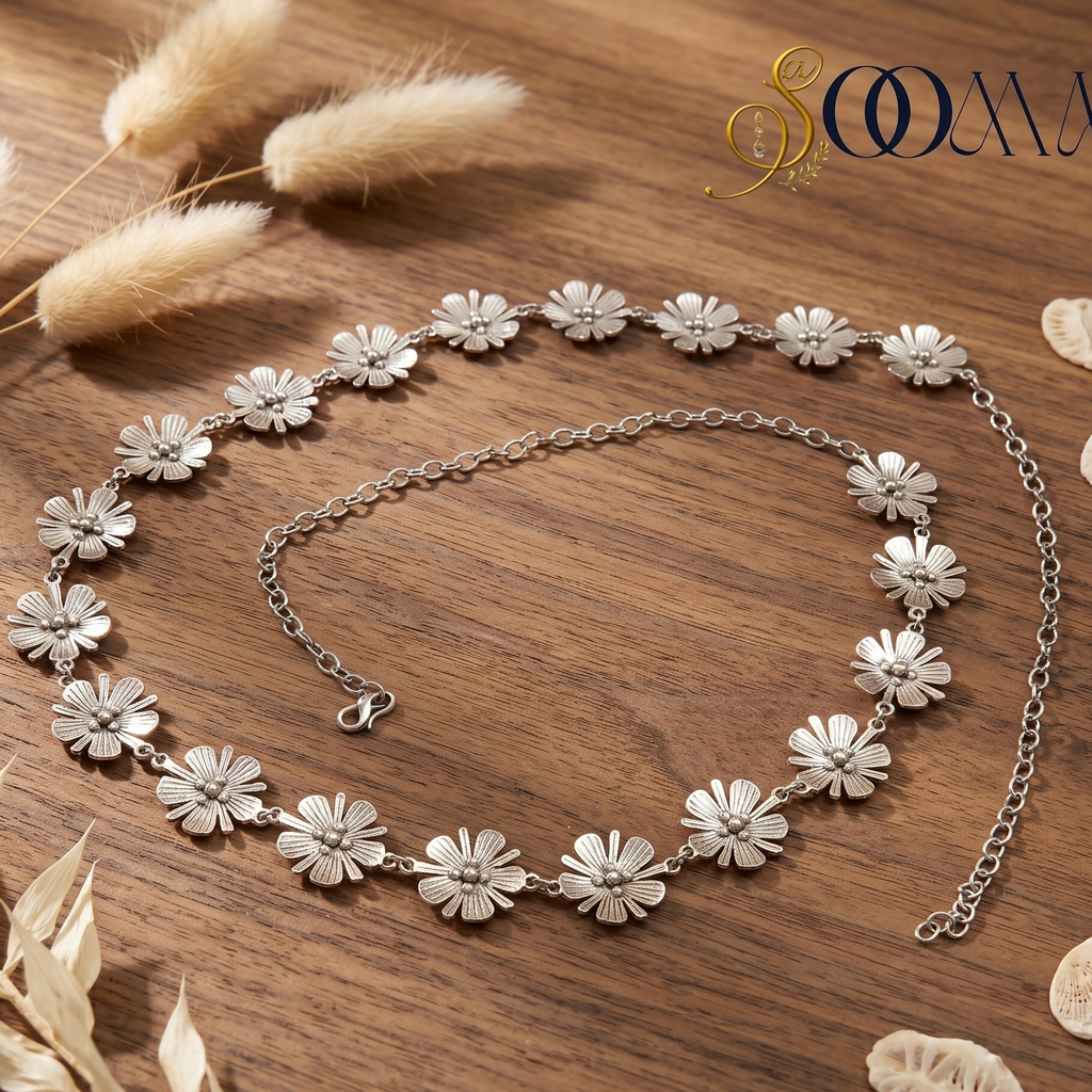 Silver floral waistbell on a wooden surface 