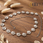 Silver floral waistbell on a wooden surface 