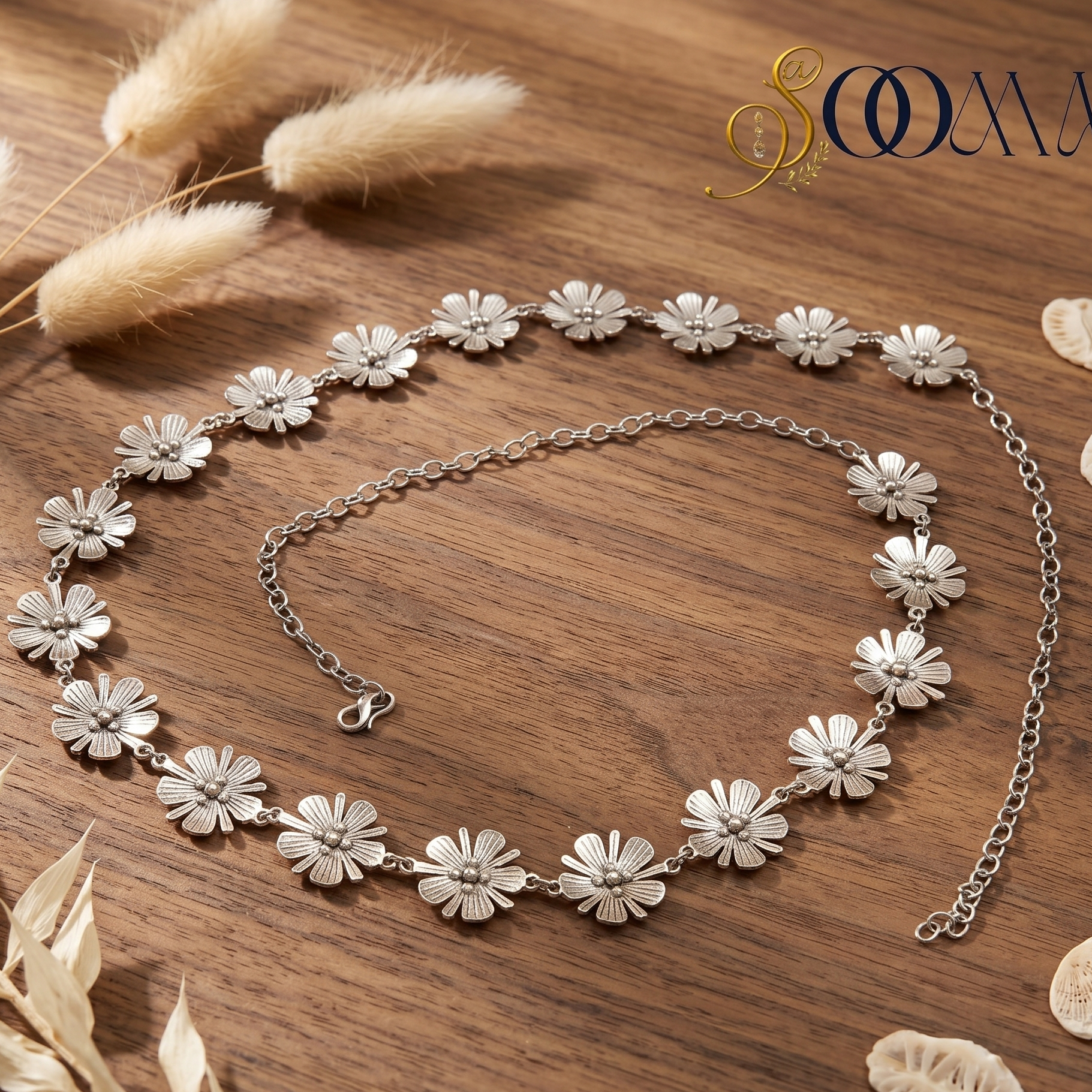 Silver floral waistbell on a wooden surface 