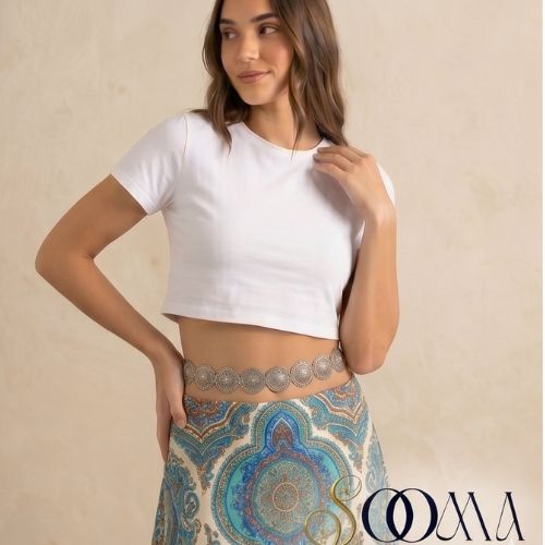 A model posing wearing a waist chain adding a touch of glamour to professional attire
