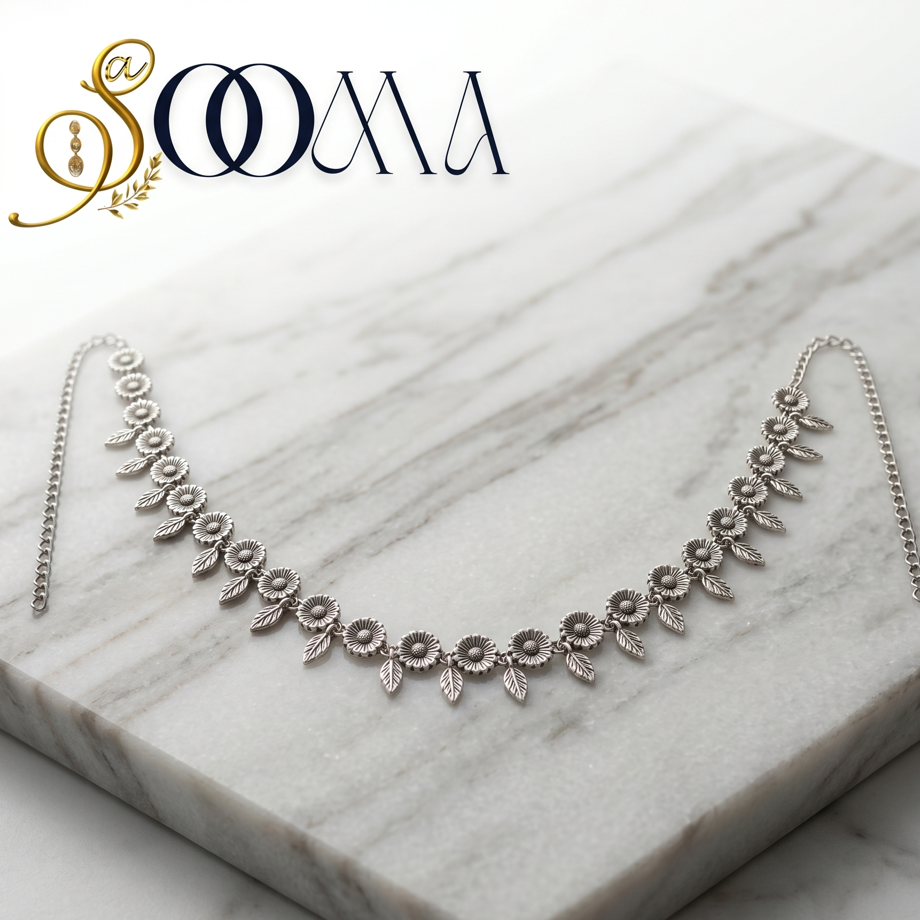 Silver belt on a marble surface with 'Sooma' branding.