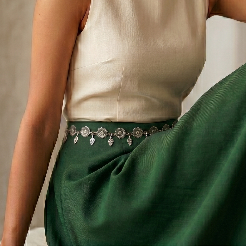 Woman wearing a Sleek flower waist chain with delicate floral design.