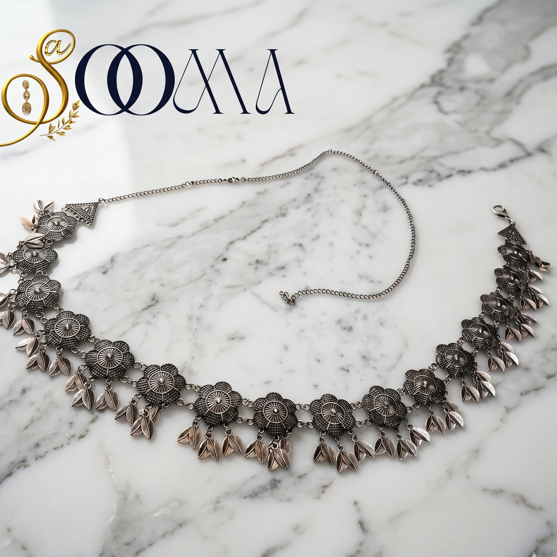 Decorative belt on a marble surface with 'Sooma' branding.
