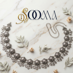 Decorative silver waist belt on a marble surface with 'SOOMA' branding.