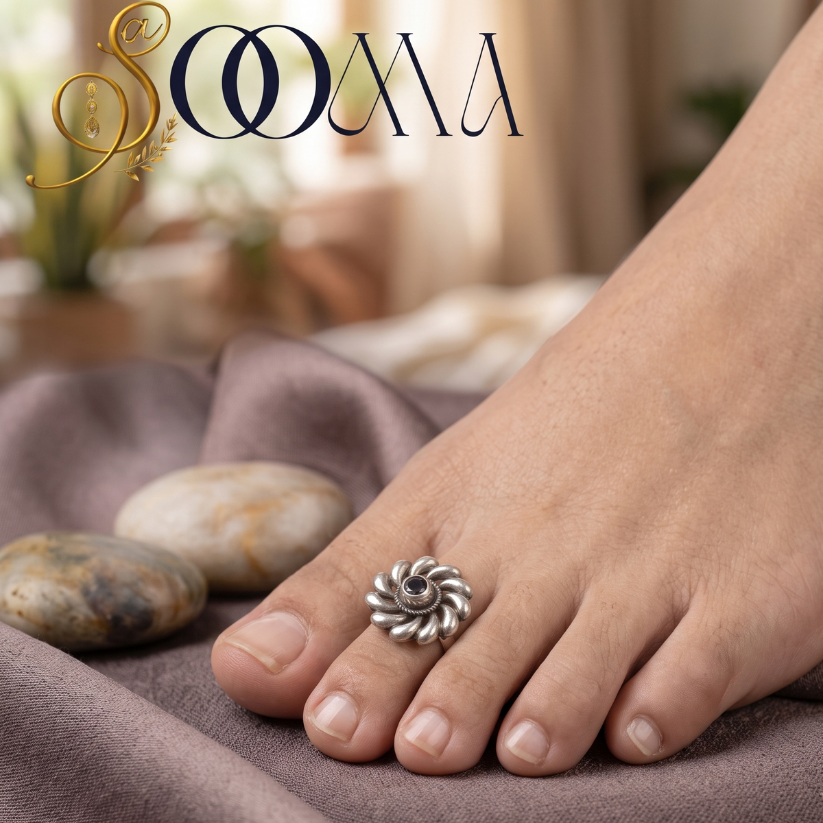 Close-up view of woman foot wearing an adjustable oxidized silver swirl flower gemstone toe ring against rustic river stones