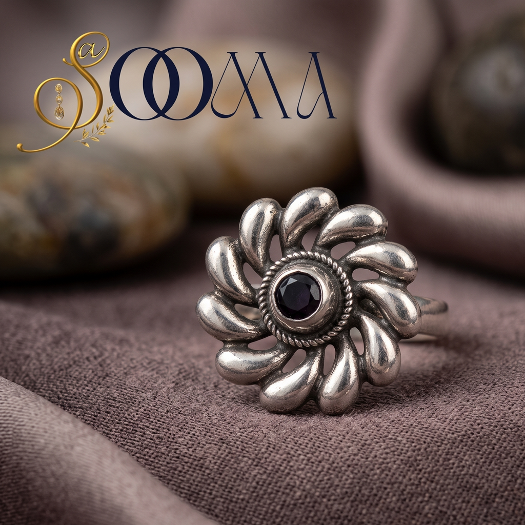 Sooma brand handcrafted oxidized silver swirl flower toe ring with dark stone centerpiece displayed flat on draped mauve satin