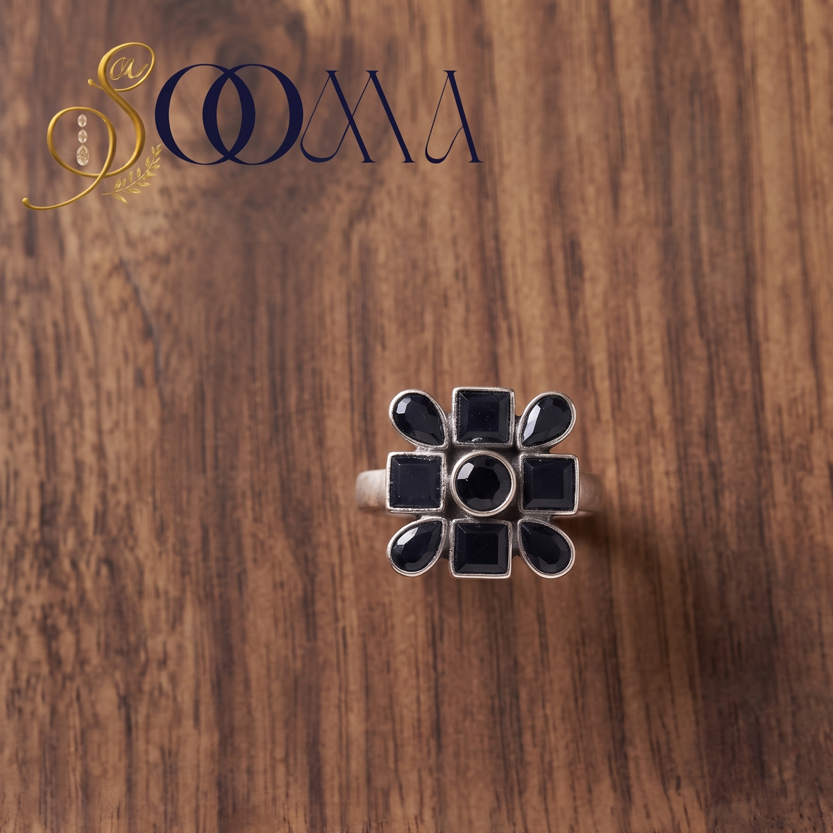 Sooma brand handcrafted oxidized silver geometric black onyx statement toe ring displayed flat on dark wooden surface