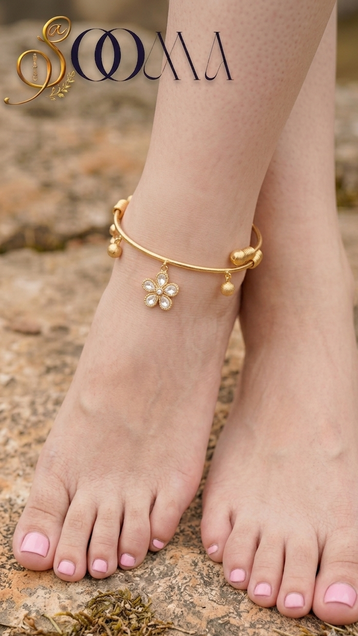 Front perspective shot of model feet wearing gold floral Kundan payal with pink nail polish