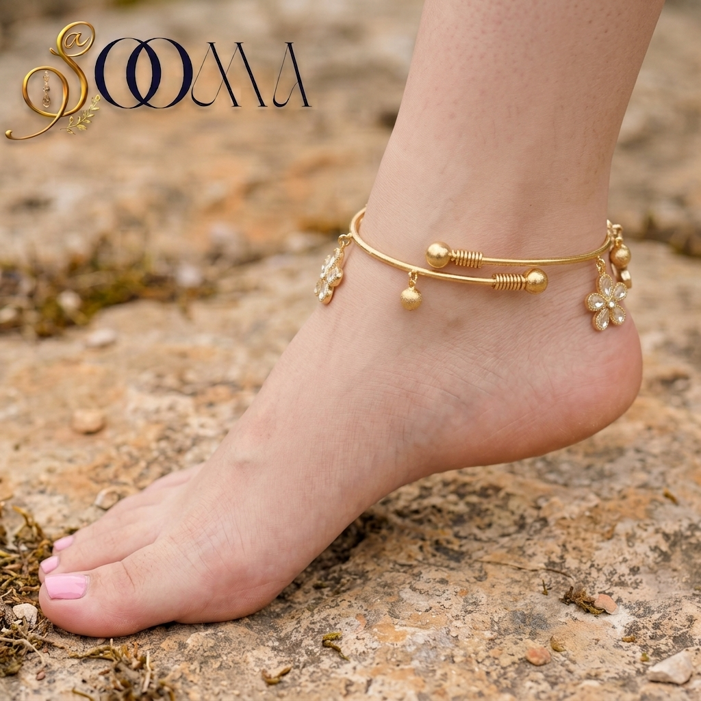 Full side view of foot showing gold floral payal with clear CZ stones and frosted ghungroo drops
