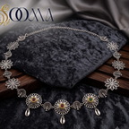 Sooma brand oxidized silver waistbelt with ruby stone medallions and cowrie shell charms on velvet