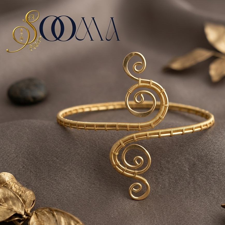 Sooma brand gold wire-wrapped spiral swirl arm cuff displayed flat on grey silk background