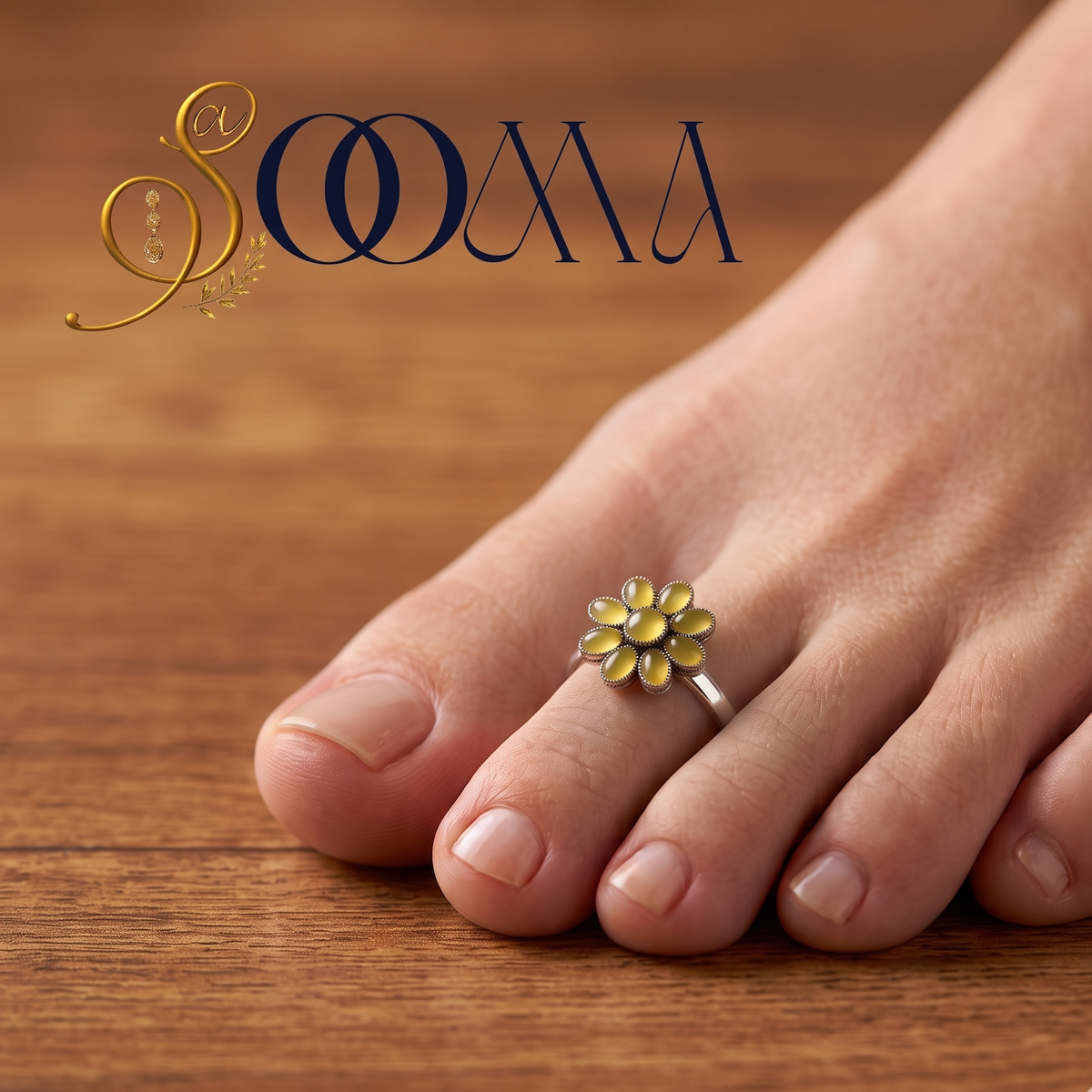 Front view of model feet on linen fabric wearing an oxidized silver yellow onyx flower toe ring