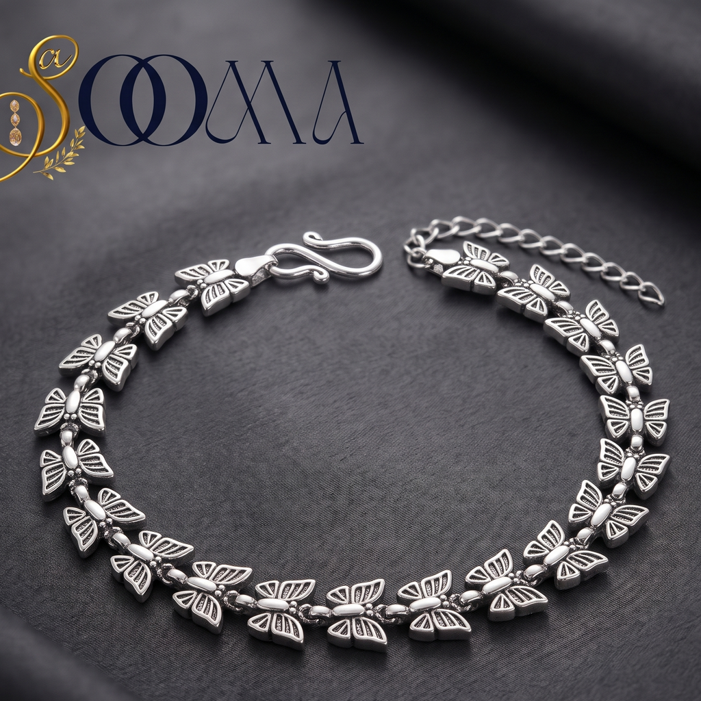 Sooma brand oxidized silver butterfly link chain anklet displayed flat on grey silk with S-hook closure