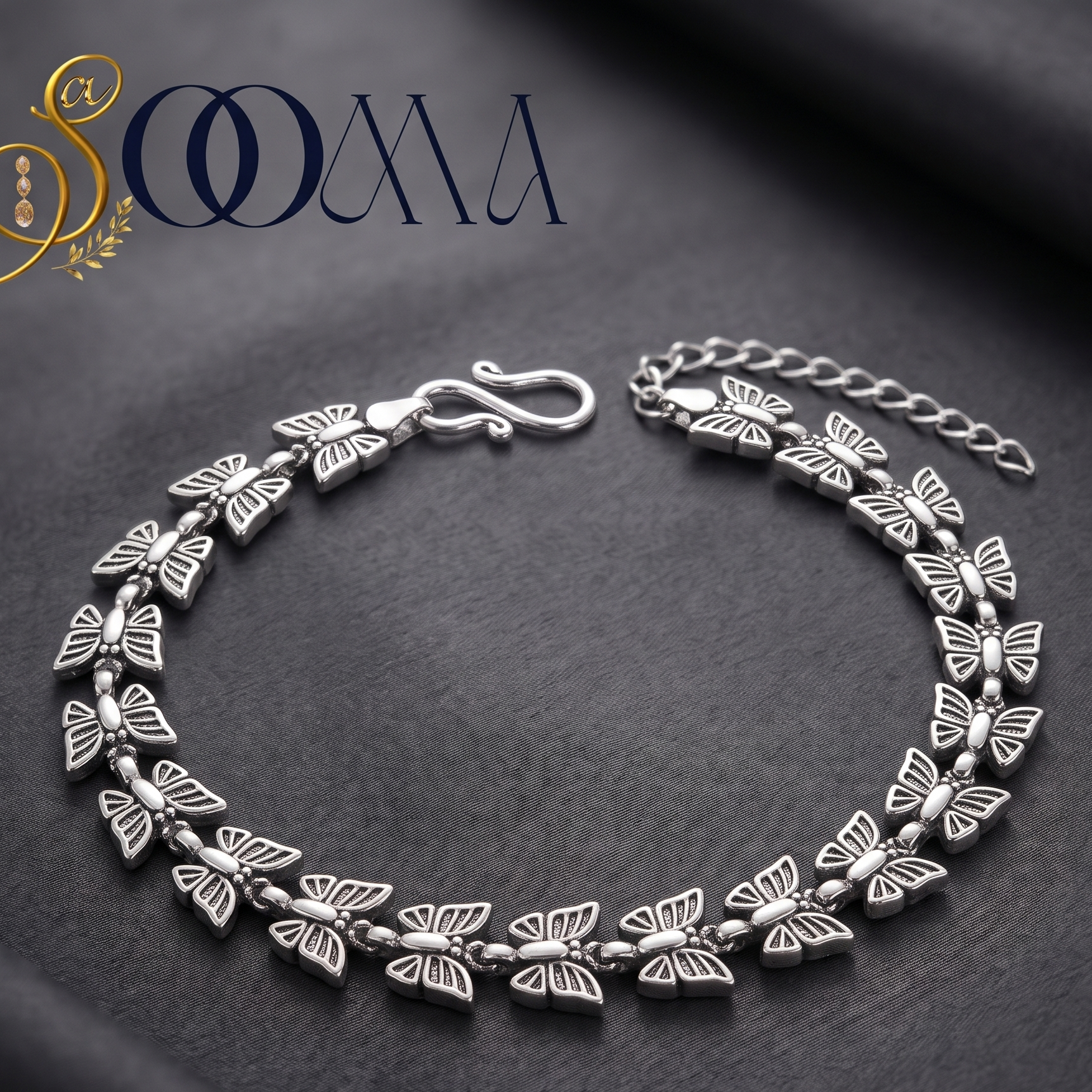 Sooma brand oxidized silver butterfly link chain anklet displayed flat on grey silk with S-hook closure