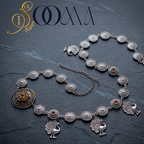 Sooma brand oxidized silver medallion waistbelt with extension chain displayed flat on dark slate background"