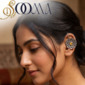 ide portrait of woman wearing non-piercing oxidized silver lotus bugadi ear cuff with yellow stone on outer cartilage