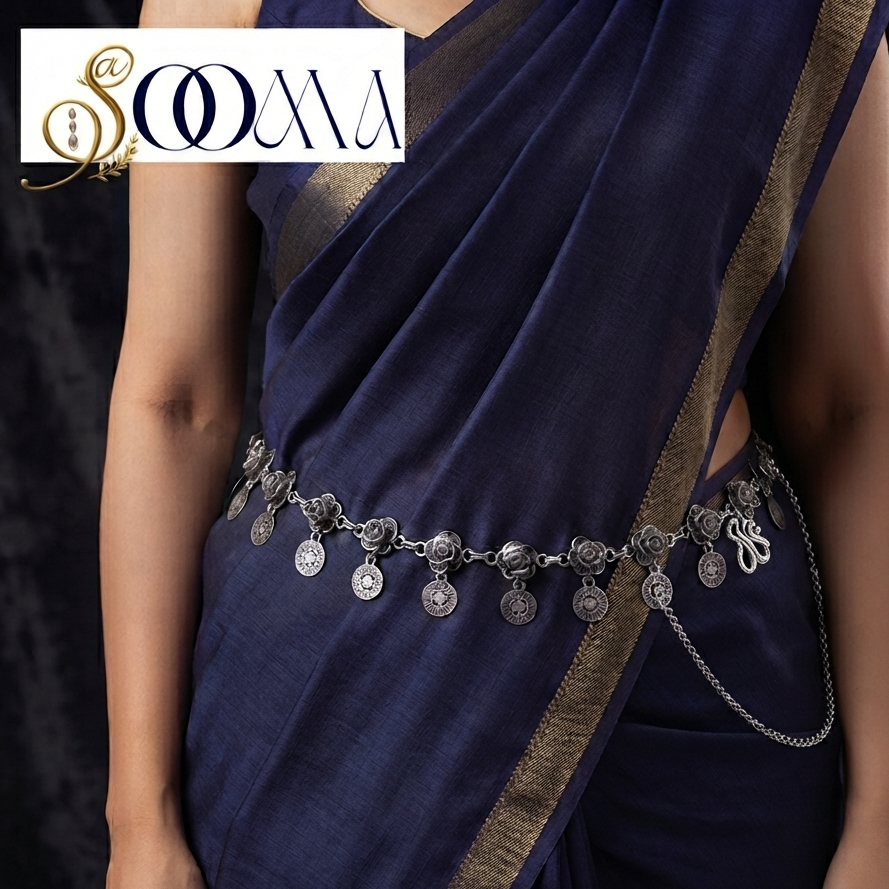 Sooma brand oxidized silver floral rosette and coin drop waist chain displayed flat on deep blue velvet background