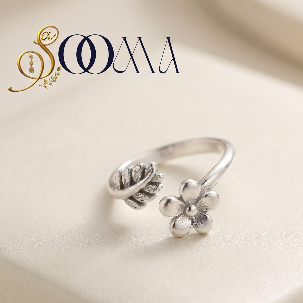 Sooma brand handcrafted oxidized silver flower and leaf adjustable bypass toe ring displayed on cream surface