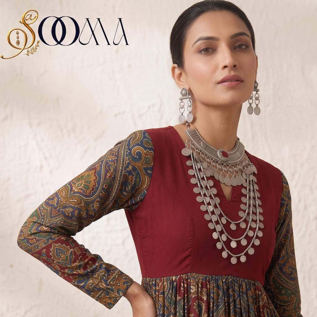 Side-angled view of model wearing Sooma brand oxidized silver tribal coin choker and multi-strand necklace stack