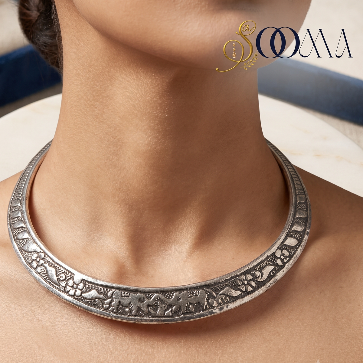 Close-up of model wearing handcrafted oxidized silver Hasli choker