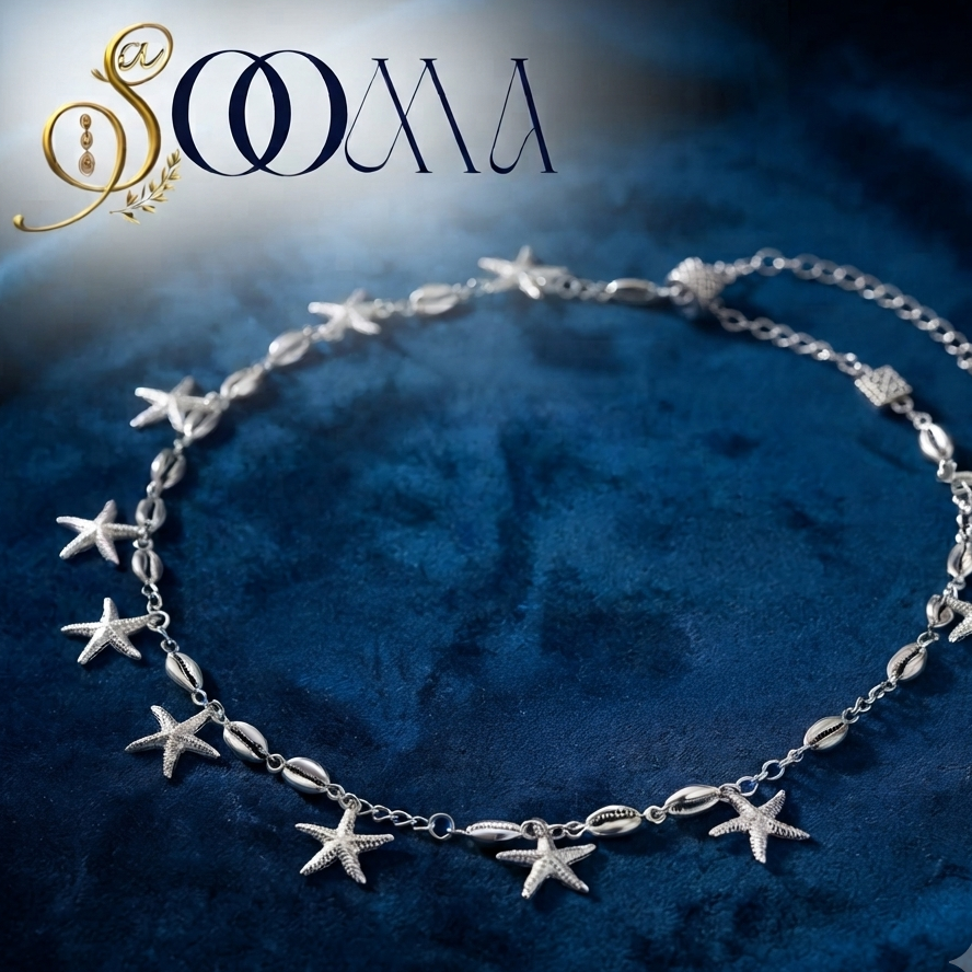 Sooma brand silver starfish and cowrie shell waist chain displayed flat on deep blue velvet background