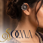 Side profile view of model wearing a clip-on silver sunflower bugadi ear cuff paired with ethnic embroidered saree