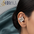 Side profile of woman styling a non-piercing oxidized silver spiral bloom bugadi ear cuff on her outer helix cartilage