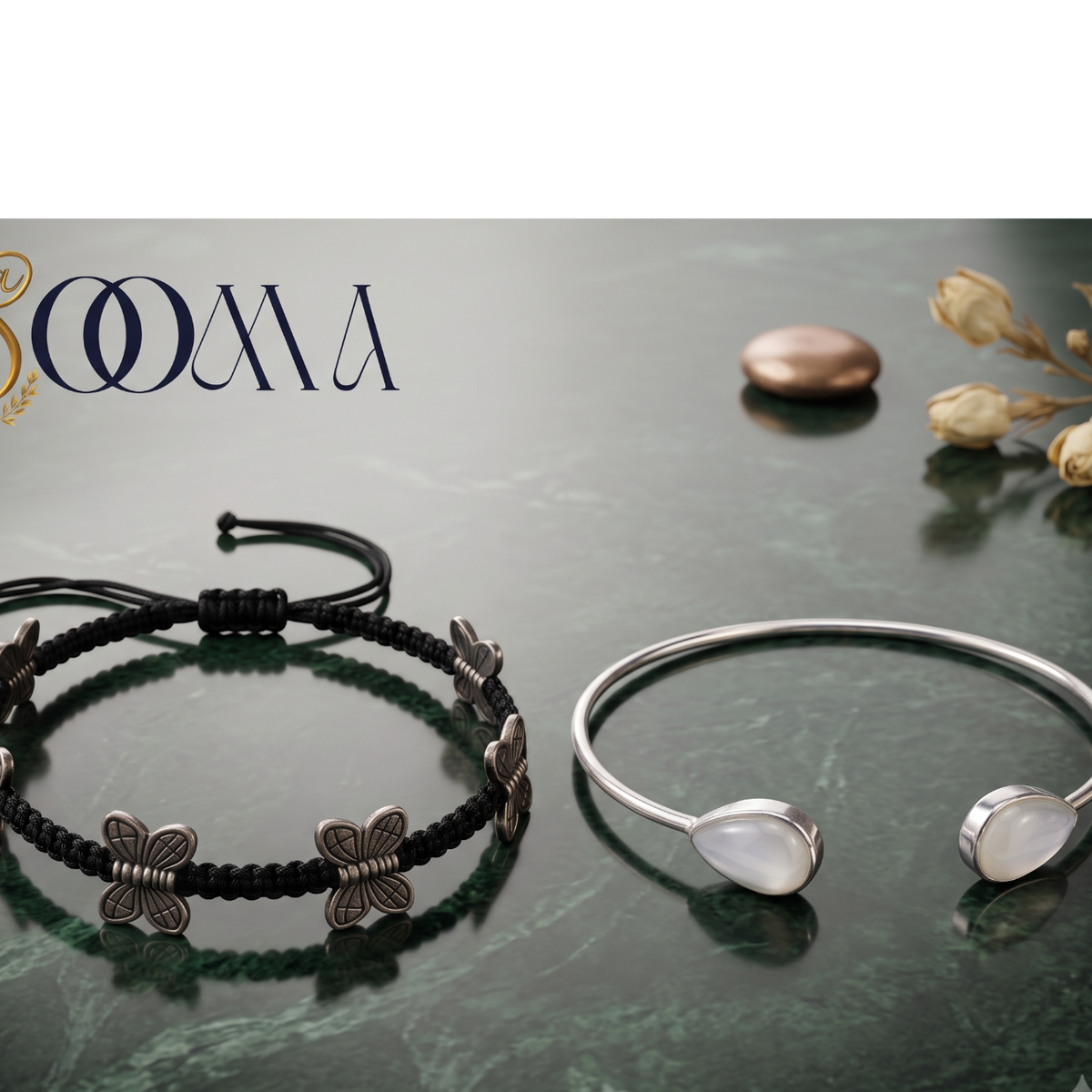 Sooma brand display banner showing 2-piece ankle stack with black macrame butterfly cord and teardrop moonstone bypass cuff flat lay on green marble