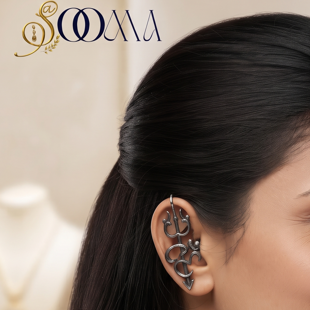 Side profile view of woman wearing a sacred non-piercing oxidized silver Trishul and Om bugadi ear cuff along her ear cartilage